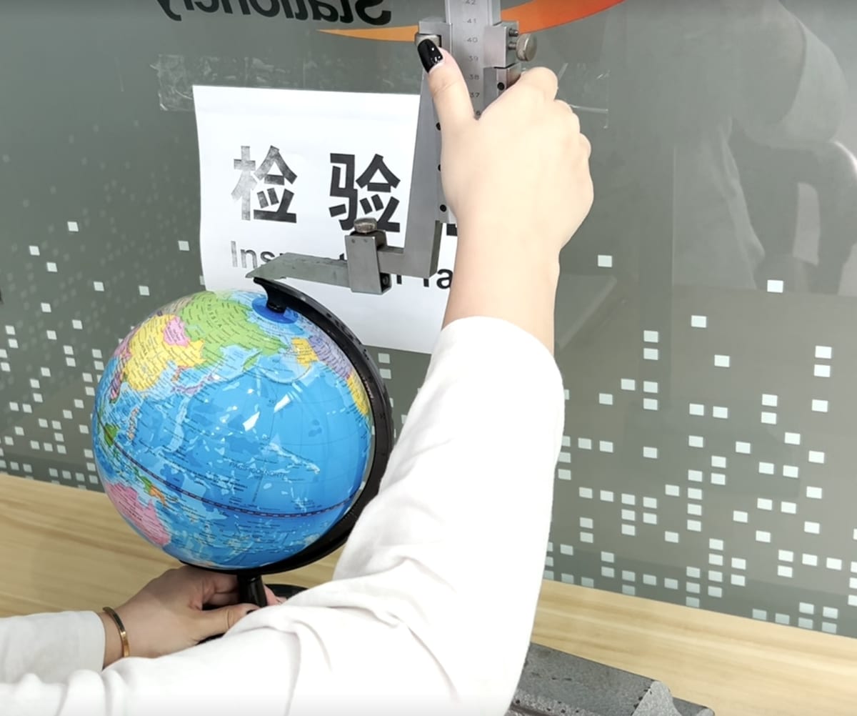 Measuring globe height with a vernier caliper