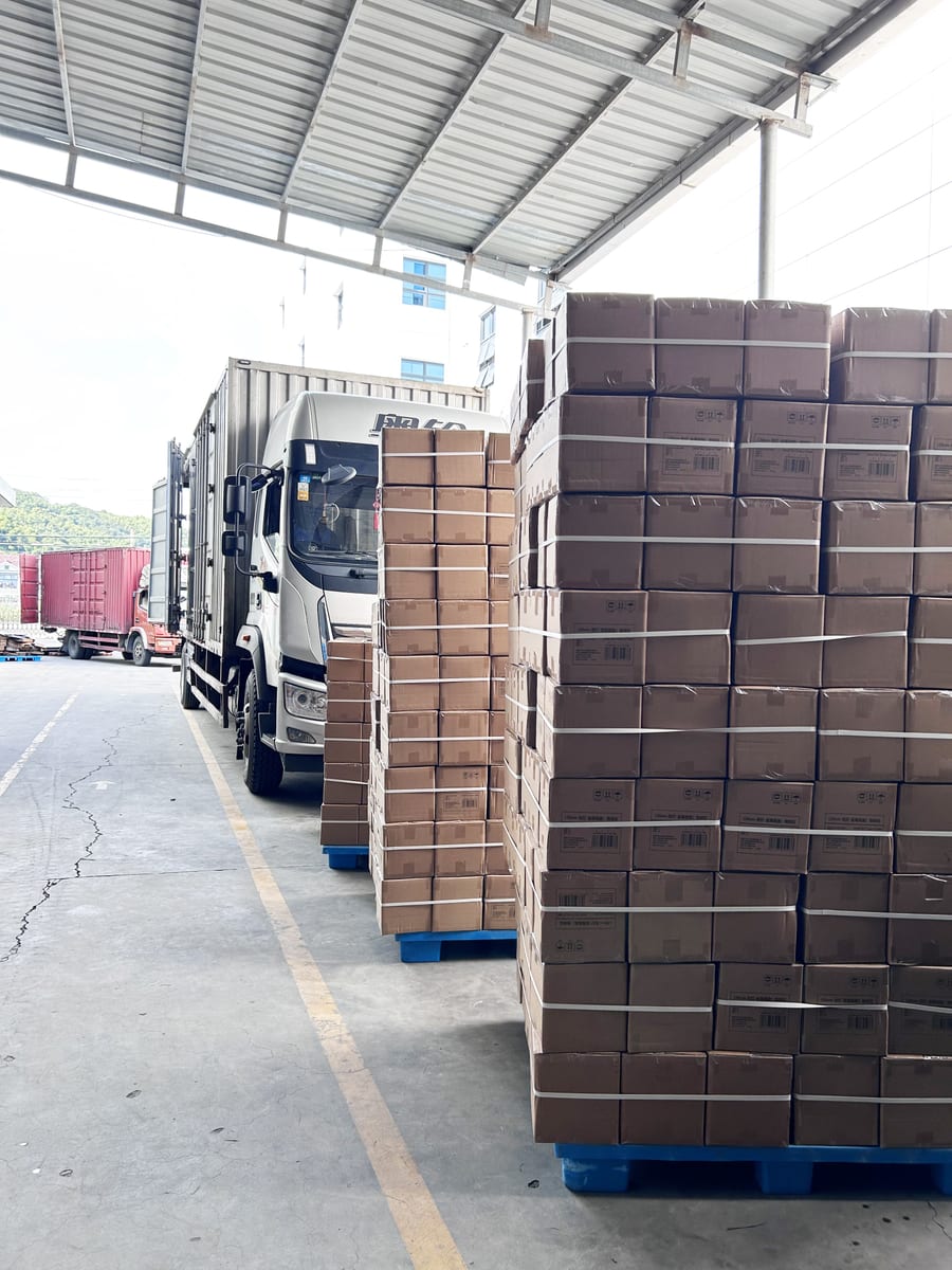 Loading cartons onto the truck at the loading dock
